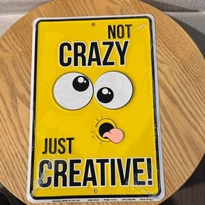 Yellow 'Not Crazy Just Creative' Sign